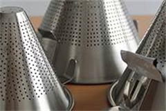 variety of different sized stainless steel conical strainers 