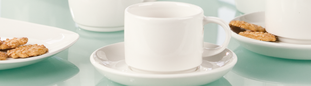 four white cups with saucers 