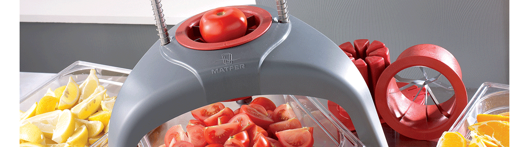 cutter chopping tomatoes into wedges, lemon slices 